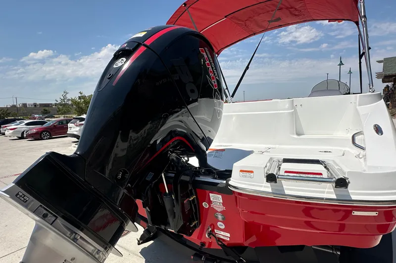 Slide: The Image of Red and white 2027 Tahoe 1950 boat with powerful outboard motor and canopy. - 7