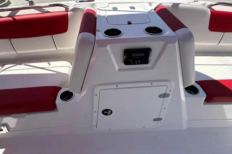 Slide: The Image of Interior of 2027 Tahoe 1950 boat with red and white seating and cup holders. - 13
