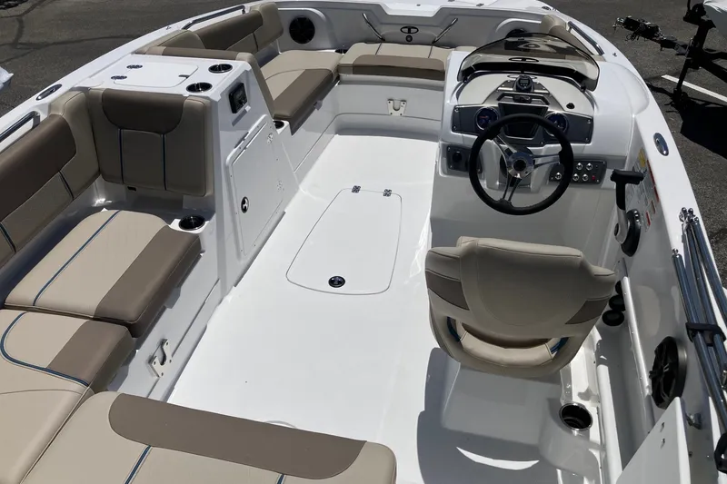 The Image of Interior of 2027 Tahoe 1950 boat with beige seating and modern dashboard. - 0