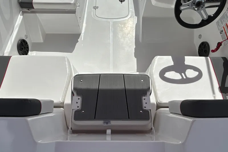Slide: The Image of Interior view of 2027 Tahoe T18 boat, featuring seating and steering wheel. - 9