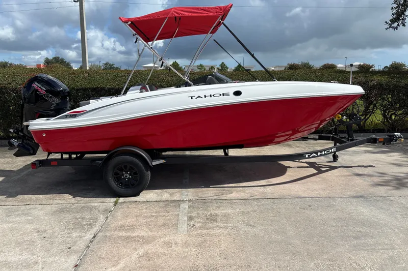 Slide: The Image of Red and white 2027 Tahoe T18 boat with canopy on trailer. - 4