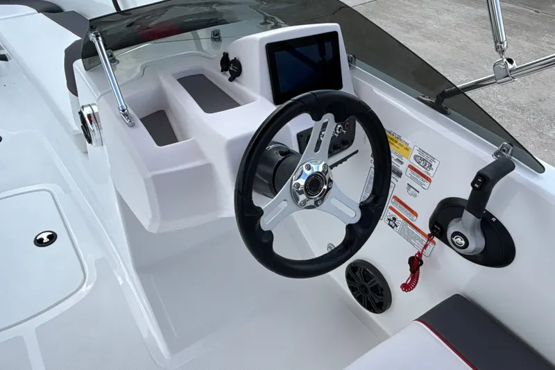 Slide: The Image of Steering console of 2027 Tahoe T18 boat with modern controls and dashboard. - 12