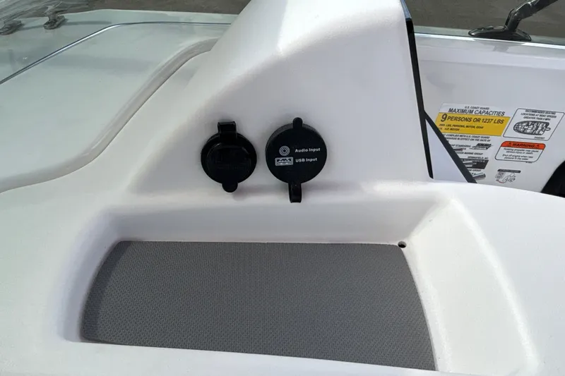 Slide: The Image of 2027 Tahoe T18 boat dashboard with audio and USB input ports. - 15