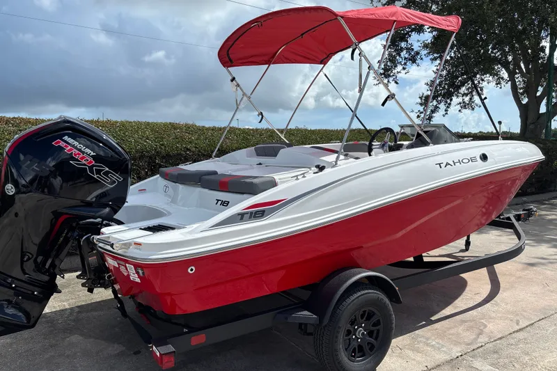Slide: The Image of 2027 Tahoe T18 boat with red canopy and Mercury Pro XS engine on trailer. - 6