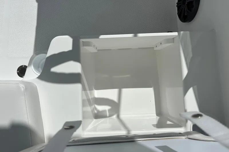 Slide: The Image of Interior compartment of 2027 Tahoe T16 boat, featuring white finish and storage space. - 23