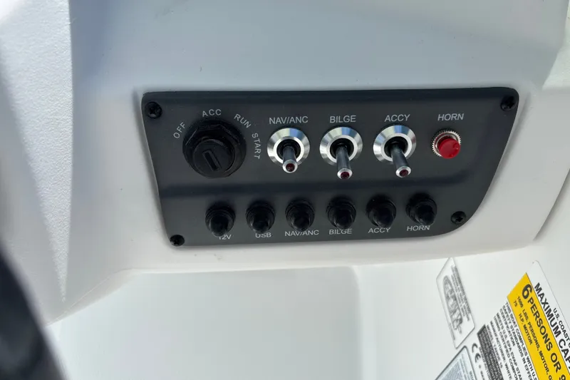 Slide: The Image of Control panel of a 2027 Tahoe T16 boat with switches and labels. - 10