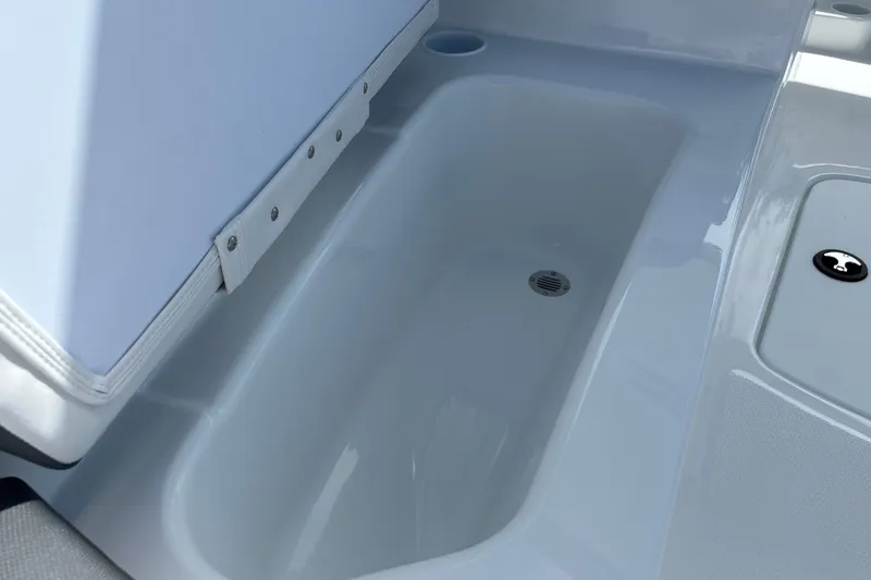 Slide: The Image of Interior view of 2027 Tahoe T16 boat compartment with drain. - 27