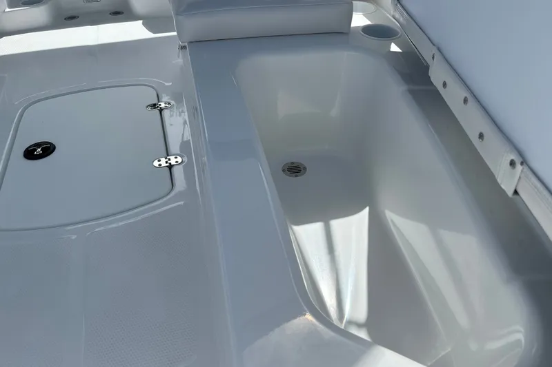 Slide: The Image of Interior view of 2027 Tahoe T16 boat showing storage compartment and seating area. - 26