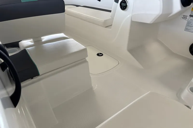 Slide: The Image of Interior of 2027 Tahoe T16 boat with white seating and modern design. - 15