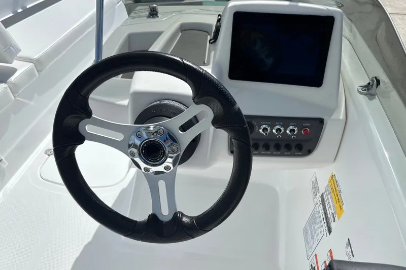 Slide: The Image of Steering wheel and dashboard of 2027 Tahoe T16 boat with control panel. - 9