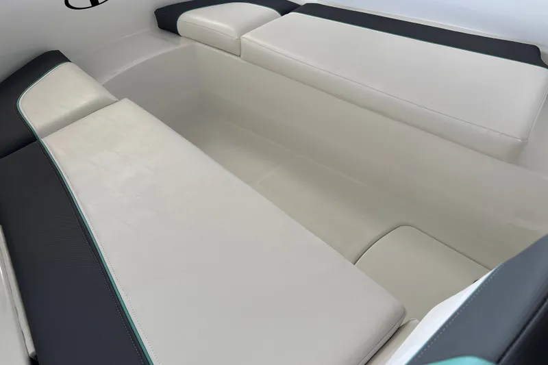 Slide: The Image of Interior seating of 2027 Tahoe T16 boat, featuring sleek white and black upholstery. - 18