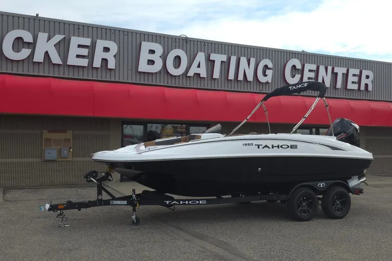 Slide: The Image of 2027 Tahoe 1950 boat on trailer at boating center. - 1