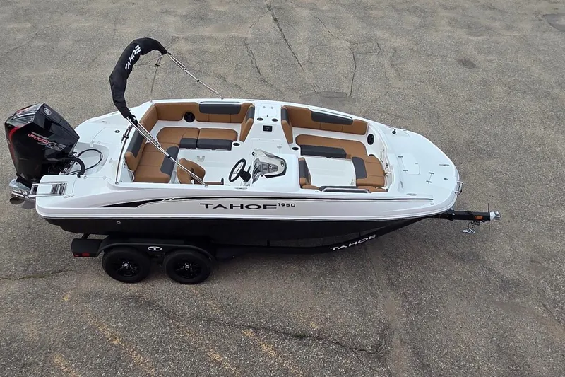Slide: The Image of 2027 Tahoe 1950 boat on trailer, featuring sleek design and spacious seating. - 6