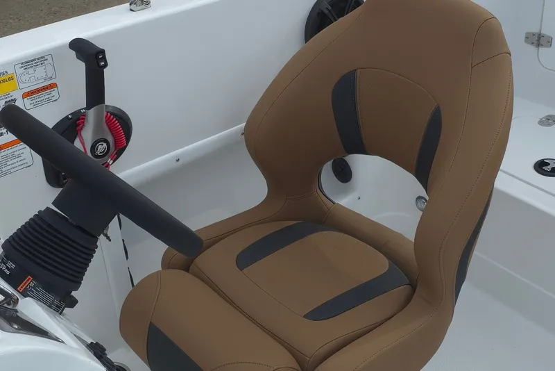 Slide: The Image of Captain's seat in a 2027 Tahoe 1950 boat, featuring ergonomic design and controls. - 12