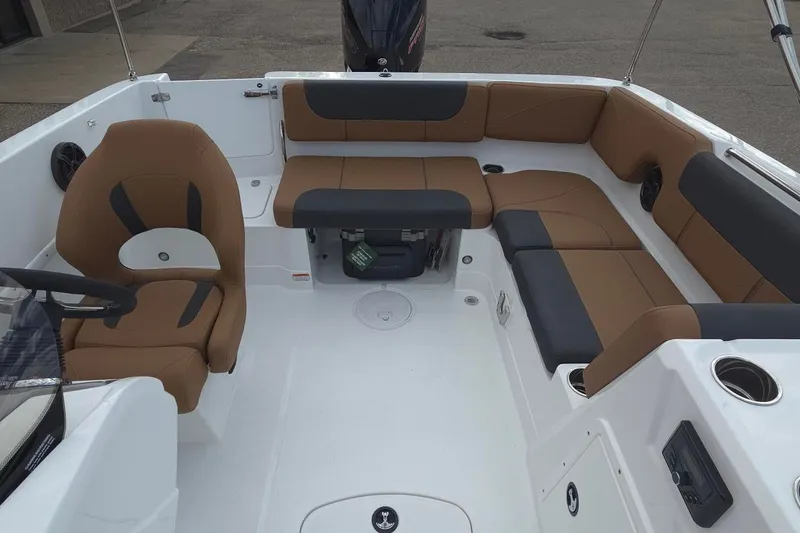 Slide: The Image of Interior of a 2027 Tahoe 1950 boat with brown and black seating. - 10
