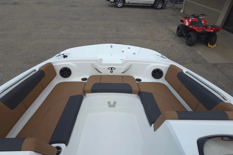 Slide: The Image of Interior of 2027 Tahoe 1950 boat with brown and black seating. - 9
