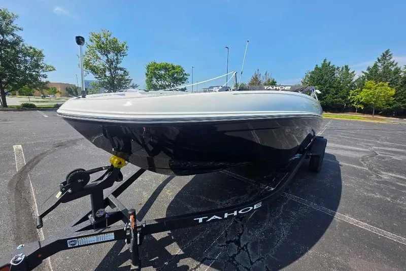 Slide: The Image of 2027 Tahoe T18 boat on trailer in parking lot, sunny day. - 1