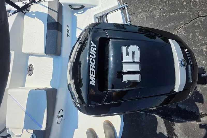 Slide: The Image of 2027 Tahoe T18 boat with Mercury 115 outboard motor on a sunny day. - 5