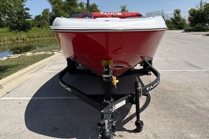 Slide: The Image of 2027 Tahoe T18 boat on trailer, parked outdoors, front view. - 5