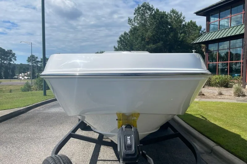 Slide: The Image of Front view of a 2027 Tahoe T21 boat on a trailer, outdoors. - 5