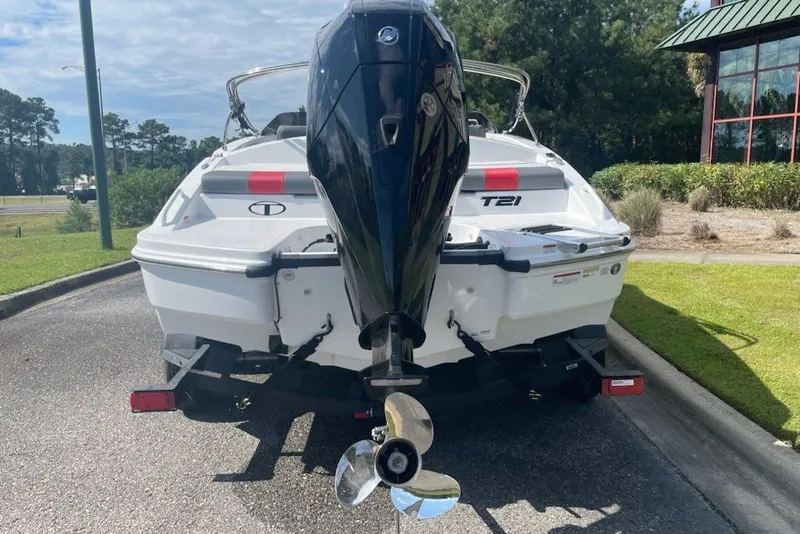 Slide: The Image of Rear view of a 2027 Tahoe T21 boat with an outboard motor. - 4