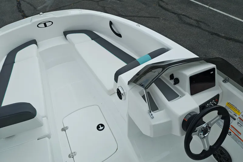 Slide: The Image of 2027 Tahoe T16 boat interior with sleek seating and modern dashboard design. - 24