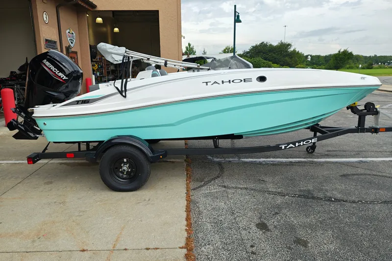 The Image of 2027 Tahoe T16 boat on trailer, featuring a sleek design and Mercury outboard motor. - 0