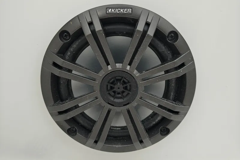 Slide: The Image of Round black speaker with a star-shaped grille, featuring the Kicker logo. - 17