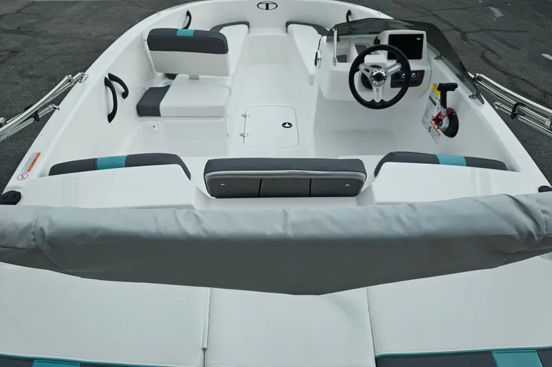 Slide: The Image of 2027 Tahoe T16 boat interior with modern steering and seating arrangement. - 22