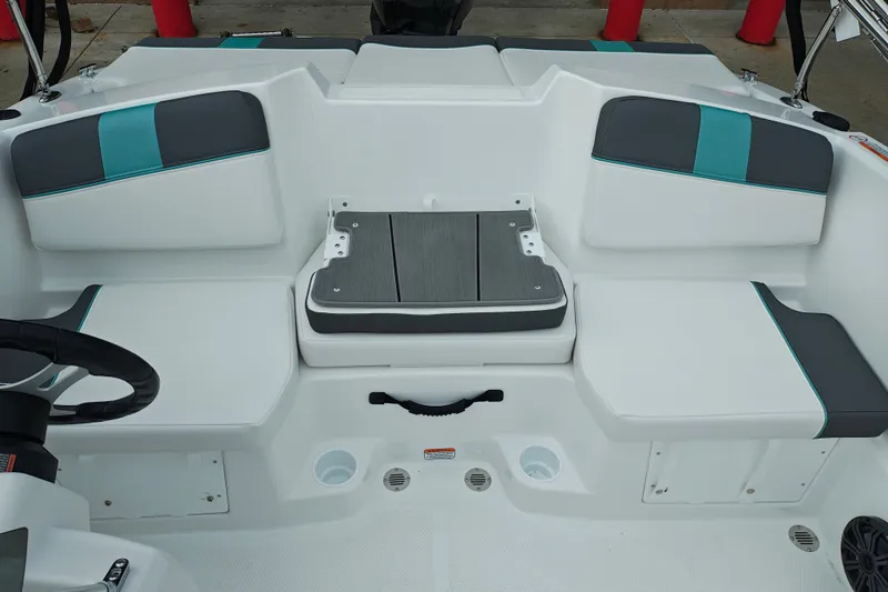 Slide: The Image of 2027 Tahoe T16 boat interior with white and teal seating, modern design. - 14