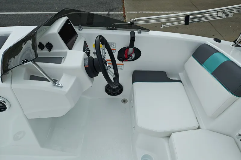 Slide: The Image of Cockpit of 2027 Tahoe T16 boat with steering wheel and modern seating. - 10