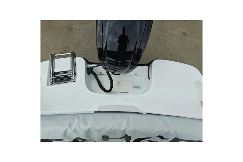 Slide: The Image of 2027 Tahoe T16 boat stern with ladder and motor, viewed from above. - 21