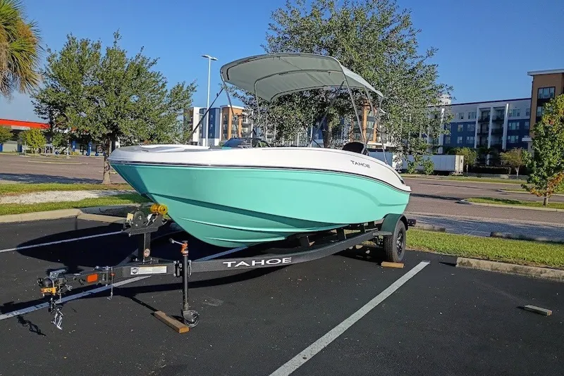 The Image of 2027 Tahoe T18 boat on trailer in parking lot, sunny day. - 0