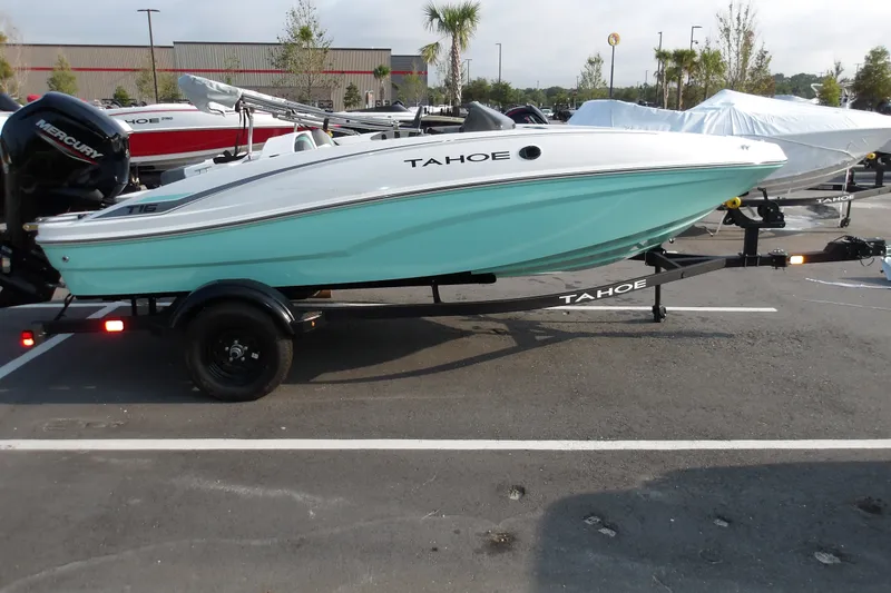The Image of 2027 Tahoe T16 boat on trailer, mint green hull, parked outdoors. - 0