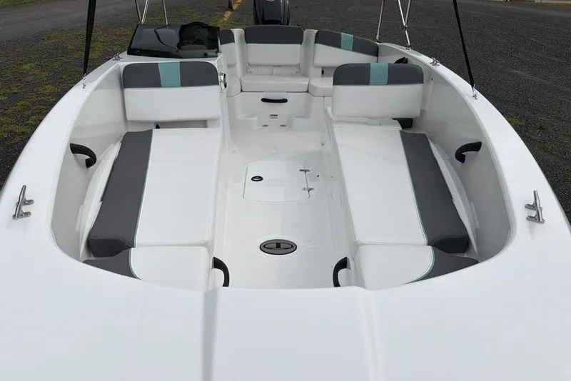 Slide: The Image of 2027 Tahoe T18 boat interior with white and gray seating, spacious layout. - 11