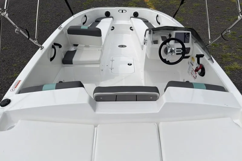 Slide: The Image of 2027 Tahoe T18 boat interior with steering wheel and seating arrangement. - 8