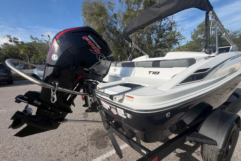 Slide: The Image of 2027 Tahoe T18 boat with Mercury Pro XS engine in a parking lot. - 4