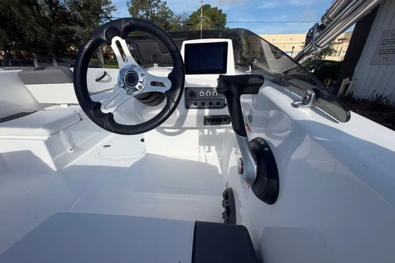 Slide: The Image of Cockpit of 2027 Tahoe T18 boat with steering wheel and control panel. - 5