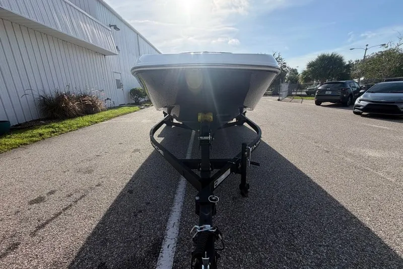 Slide: The Image of Front view of a 2027 Tahoe T18 boat on a trailer in a parking lot. - 3