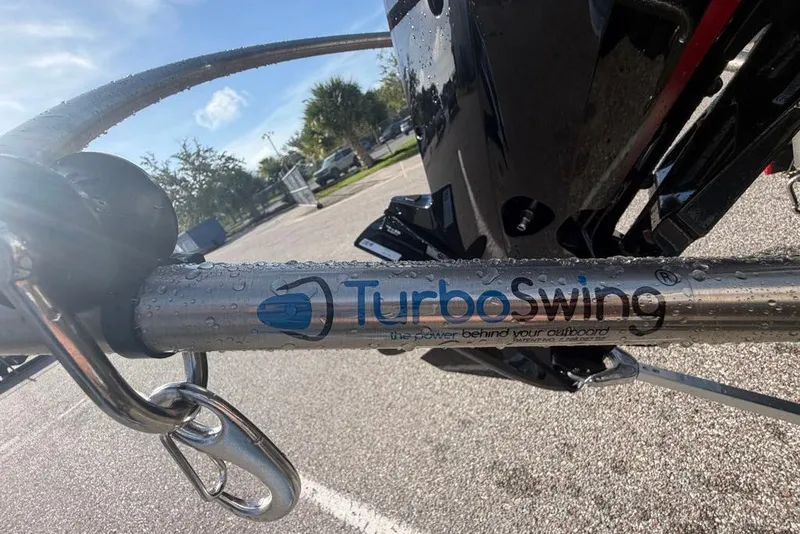 Slide: The Image of Close-up of TurboSwing on a 2027 Tahoe T18 boat, with water droplets and sunny background. - 69