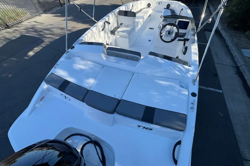 Slide: The Image of 2027 Tahoe T18 boat with sleek white design and modern seating arrangement. - 8