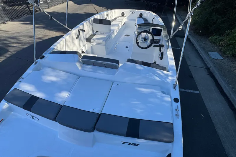 Slide: The Image of 2027 Tahoe T18 boat with sleek design, spacious seating, and modern steering console. - 6