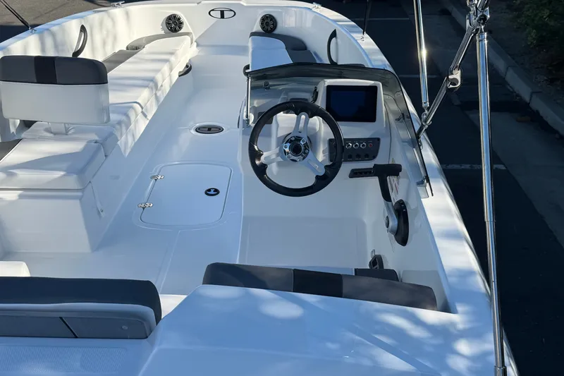 Slide: The Image of 2027 Tahoe T18 boat interior with steering wheel, seating, and control panel. - 7