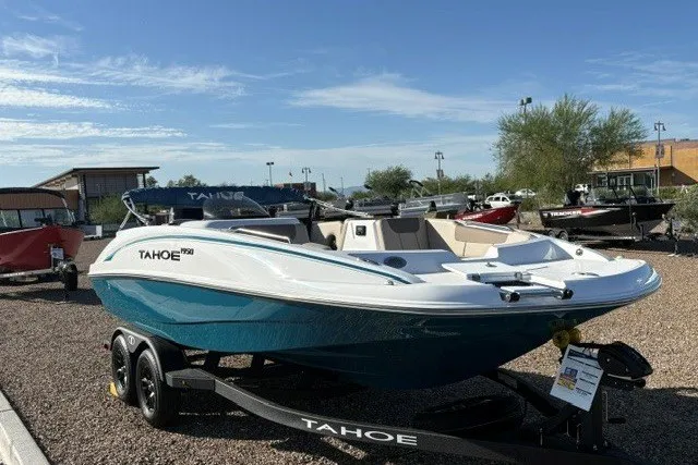 Slide: The Image of 2027 Tahoe 1950 boat on trailer, displayed outdoors under clear blue sky. - 4
