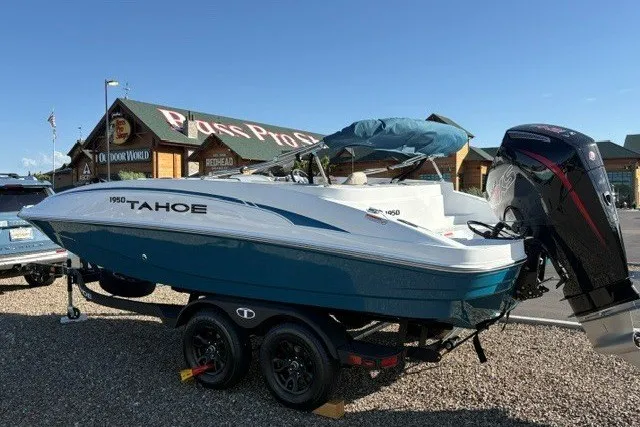 Slide: The Image of Tahoe 1950 boat, 2027 model, on trailer in outdoor setting. - 1