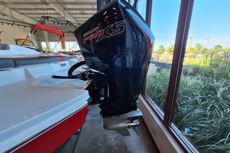 Slide: The Image of 2027 Tahoe T21 boat with Mercury Pro XS outboard motor in showroom. - 94