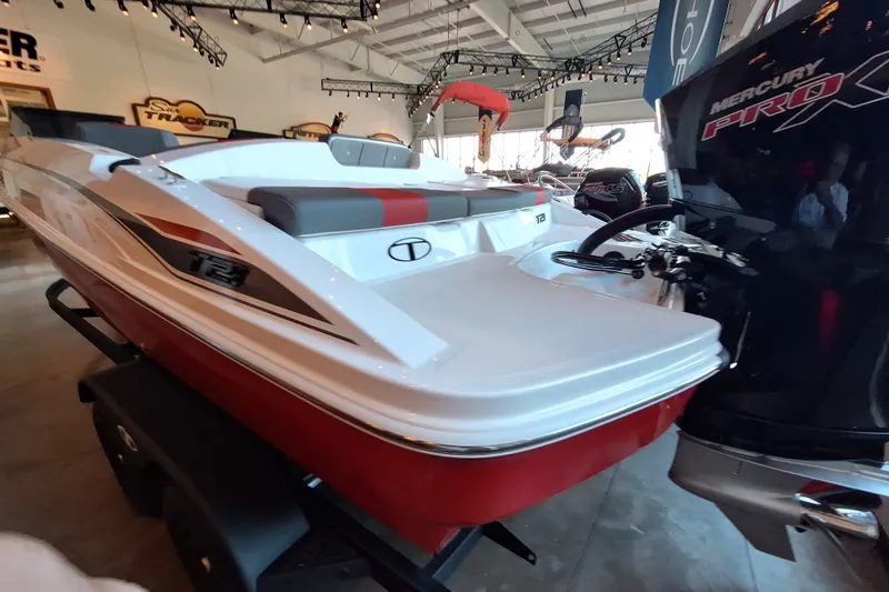 Slide: The Image of 2027 Tahoe T21 boat with Mercury Pro motor in showroom. - 7