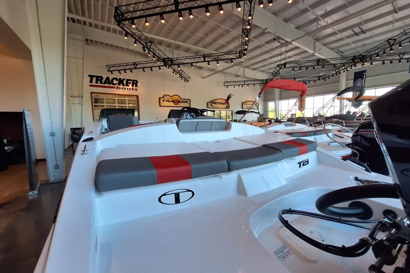 Slide: The Image of 2027 Tahoe T21 boat displayed in showroom with Tracker branding. - 5