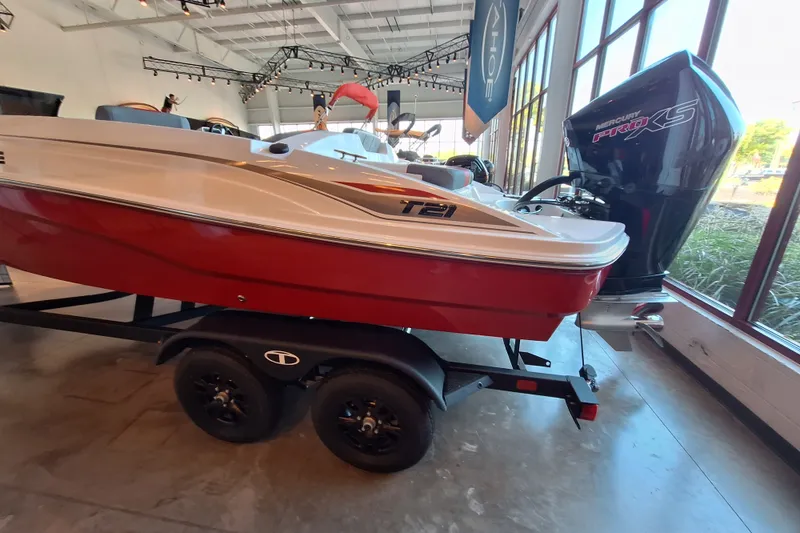 Slide: The Image of 2027 Tahoe T21 boat with Mercury Pro XS engine on display indoors. - 6