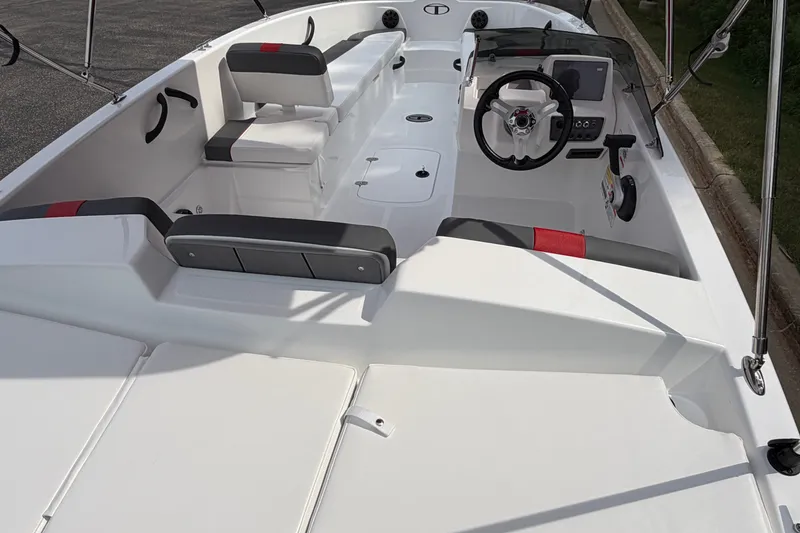 Slide: The Image of 2027 Tahoe T18 boat interior with steering wheel, seating, and control panel. - 21